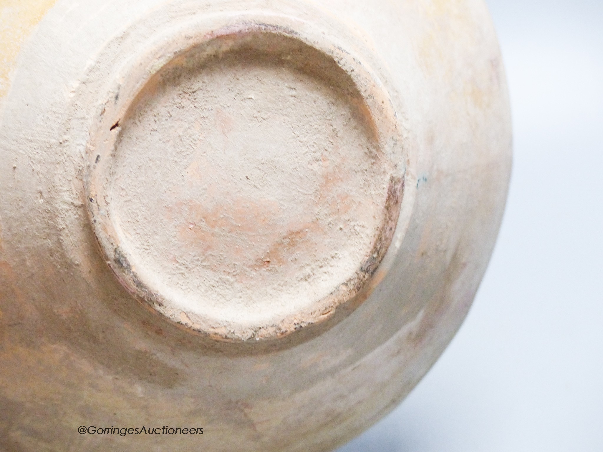 An Islamic bowl with kufic script, diameter 24cm
